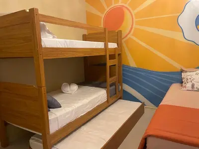 Uma cama ou camas num quarto em Casa ao mar -Pousada Itapema