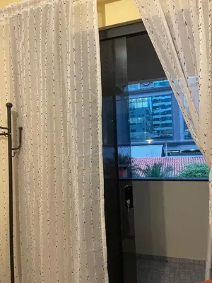 Uma televisão e/ou sistema de entretenimento em Casa ao mar -Pousada Itapema
