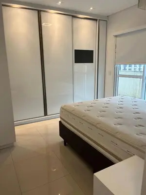 Uma cama ou camas num quarto em Cobertura de 2 suites no centro de Bombinhas by RD Stay