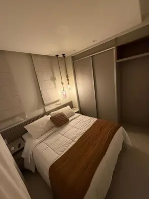 Uma cama ou camas num quarto em Apartamento Flat Elegance Bombinhas