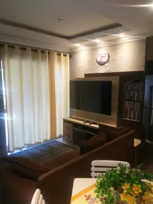 Uma televisão e/ou sistema de entretenimento em Casa 1 Encanto dos Mares