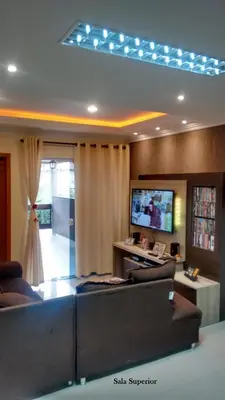 Uma televisão e/ou sistema de entretenimento em Casa 1 Encanto dos Mares