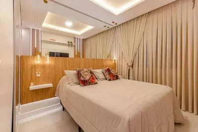 Uma cama ou camas num quarto em Apartamento finamente decorado em Bombinhas