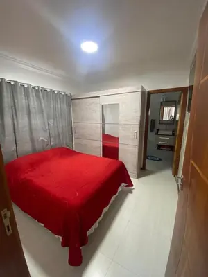 Uma cama ou camas num quarto em Casa em Zimbros Bombinhas