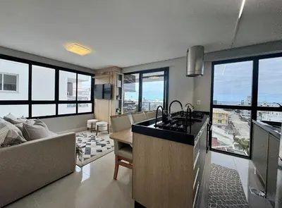 A cozinha ou kitchenette de Residencial Alana - Apartamento a 200m do mar na Praia de Palmas com vista pro mar