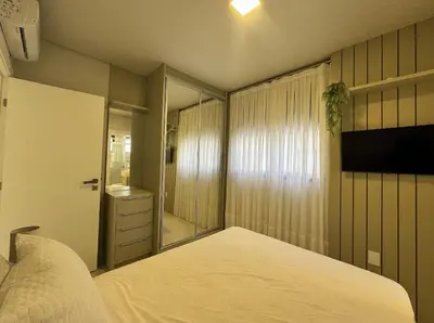Uma cama ou camas num quarto em Sonho de Palmas 101 - Apartamento de frente para o mar na deslumbrante praia de Palmas, com 3 dormitórios, sendo 2 suítes.