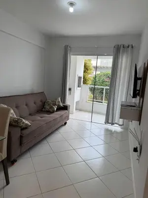 Uma área de estar em Apartamento Bombas