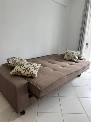 Uma área de estar em Apartamento Bombas