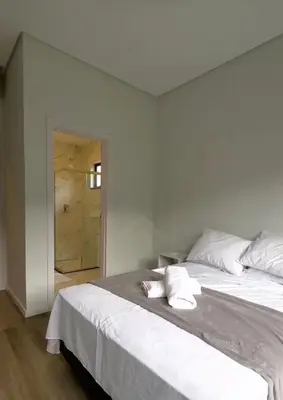 Uma cama ou camas num quarto em Casa com 3 quartos em Bombinhas