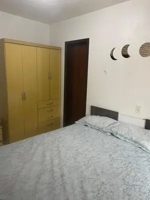 Uma cama ou camas num quarto em Sobrado 300m praia de Bombas