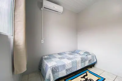 Uma cama ou camas num quarto em Casa na Vila Gastronômica em Palmas - 0304