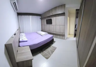 Uma cama ou camas num quarto em Apto 3 quartos 3 garagens prox ao Russi Meia Praia