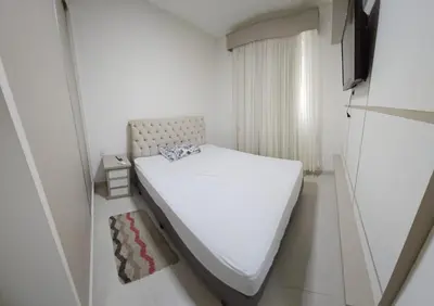 Uma cama ou camas num quarto em Apto 3 quartos 3 garagens prox ao Russi Meia Praia