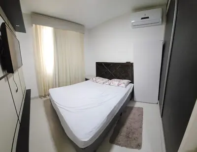 Uma cama ou camas num quarto em Apto 3 quartos 3 garagens prox ao Russi Meia Praia