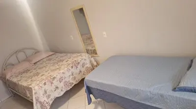 Uma cama ou camas num quarto em Casa Espaçosa Meia Praia