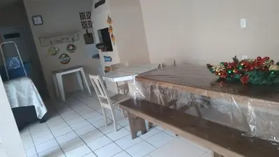 Uma televisão e/ou sistema de entretenimento em Casa Espaçosa Meia Praia