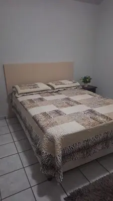 Uma cama ou camas num quarto em Casa Espaçosa Meia Praia
