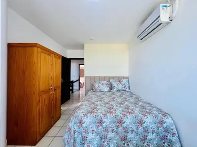Uma cama ou camas num quarto em Residencial Mar de Mariscal