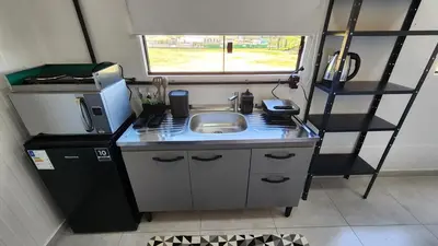 A cozinha ou kitchenette de Ap Conteiner, 2 piso, com vista, 7min da praia de carro c ar condicionado