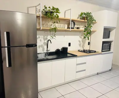 A cozinha ou kitchenette de Casa pertinho da Praia Central de Itapema
