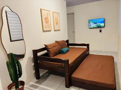 Uma cama ou camas num quarto em Casa pertinho da Praia Central de Itapema