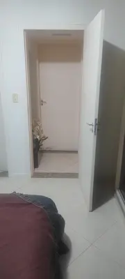 Uma cama ou camas num quarto em Suíte na rua da praia