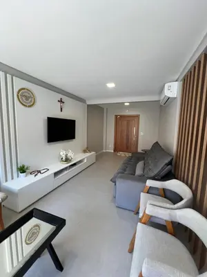 Uma televisão e/ou sistema de entretenimento em Casa de Praia Palmas GCR SC