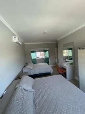 Uma cama ou camas num quarto em Casa de Praia Palmas GCR SC