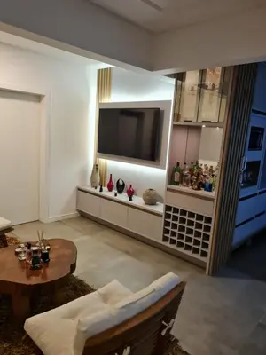 Uma televisão e/ou sistema de entretenimento em Apartamento Itapema Caravan