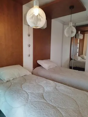 Uma cama ou camas num quarto em APARTMENTO em BOMBINHAS Vista Mar