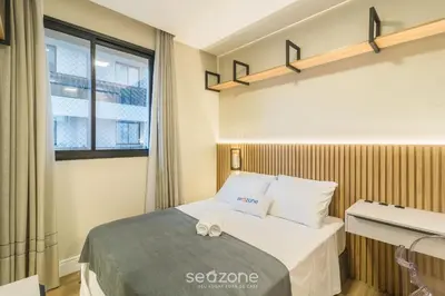 Uma cama ou camas num quarto em Apto c/ Churrasqueira a 900 m da Praia EPD0702