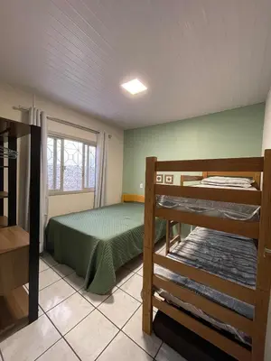 Uma cama ou camas num quarto em Casa de praia Mariscal