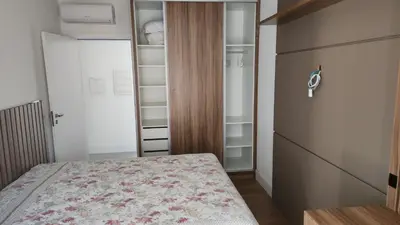 Uma cama ou camas num quarto em Apartamento Novo Vista Mar - Próximo ao Pier