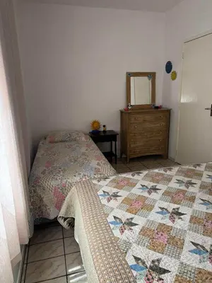 Uma cama ou camas num quarto em Minha Casa Palmas 2