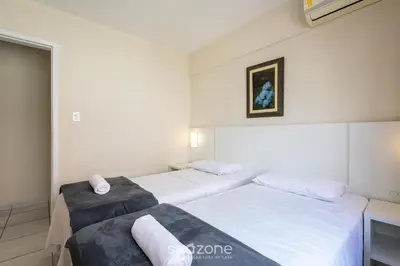 Uma cama ou camas num quarto em Apto no Centro de Itapema, a 200m do Mar EBM0122