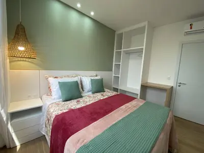 Uma cama ou camas num quarto em Apartamento com vista ao mar à 60 metros da praia do mariscal