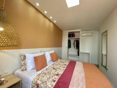 Uma cama ou camas num quarto em Apartamento com vista ao mar à 60 metros da praia do mariscal