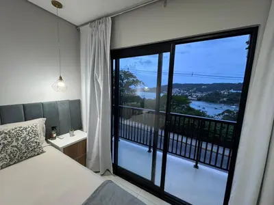 Uma cama ou camas num quarto em Jollie Loft em Calheiros Governador Celso Ramos