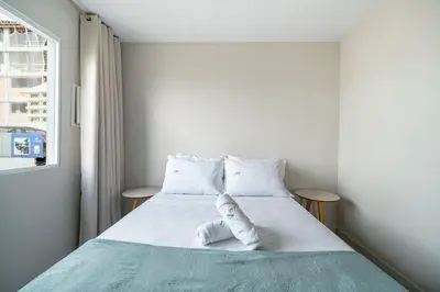 Uma cama ou camas num quarto em Achei Itapema • Res. Adriana Bombas, Bombinhas
