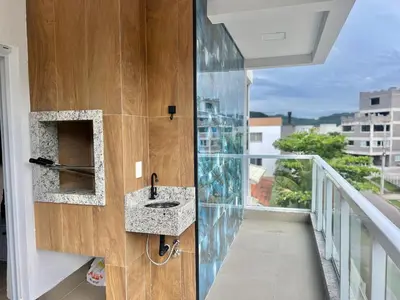 Uma varanda ou terraço em Lindo! Apartamento na Praia de Palmas - DE03J