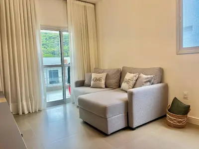 Uma área de estar em Lindo! Apartamento na Praia de Palmas - DE03J
