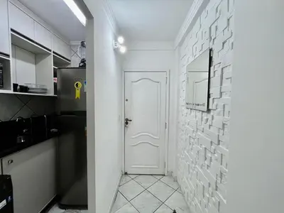 A cozinha ou kitchenette de Apartamento confortável a 100 metros da praia de Balneário