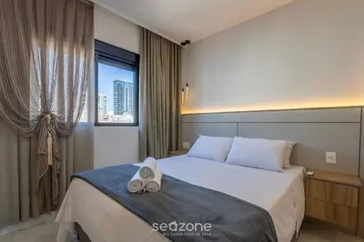 Uma cama ou camas num quarto em Apto c/ varanda gourmet a 700m da Praia BON1101