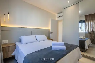 Uma cama ou camas num quarto em Apto c/ varanda gourmet a 700m da Praia BON1101