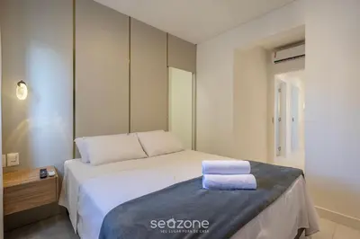 Uma cama ou camas num quarto em Apto c/ varanda gourmet a 700m da Praia BON1101