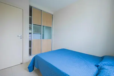 Uma cama ou camas num quarto em Apartamento a poucos passos da Praia de Bombas