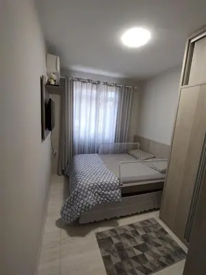 Uma cama ou camas num quarto em Aconchegante apartamento próximo ao mar!