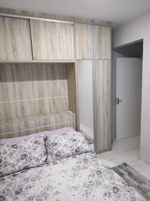 Uma cama ou camas num quarto em Aconchegante apartamento próximo ao mar!