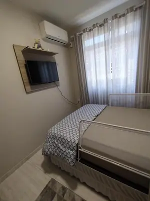 Uma cama ou camas num quarto em Aconchegante apartamento próximo ao mar!