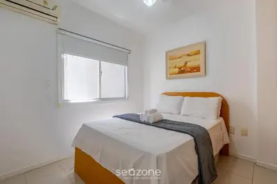 Uma cama ou camas num quarto em Aptos em Condo Beira-Mar em Itapema - DNL